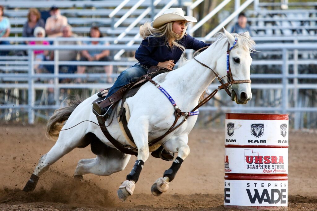 Woman riding a horse at a rodeo